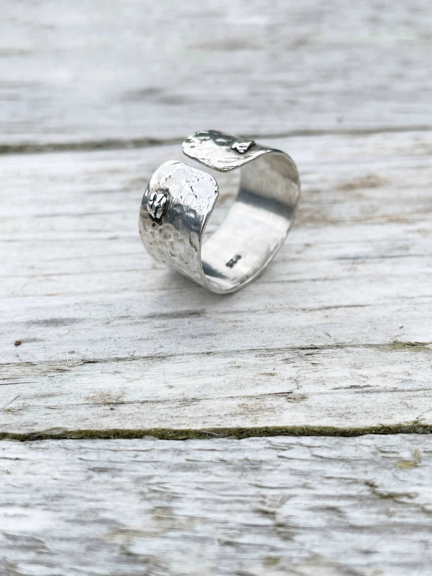 front detail of handmade Hammered Rivet Silver Ring with adjustable open-front design.