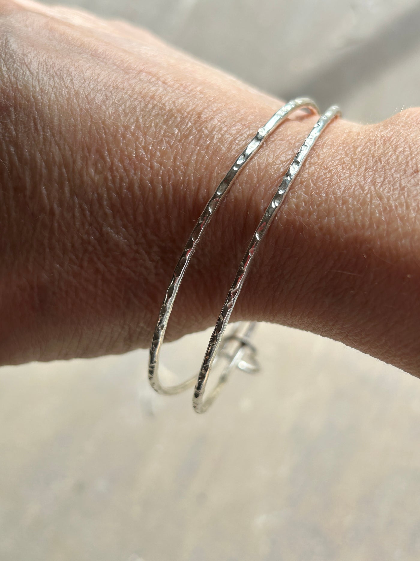 Double Hammered Bangle with Heart Charm