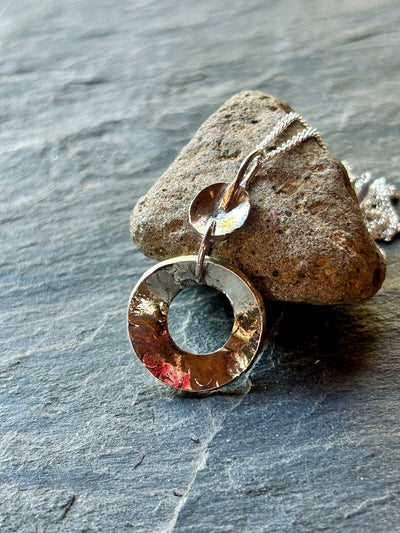 Sterling Silver Concave Pendant by LaVidaLoca Jewellery shown against stone