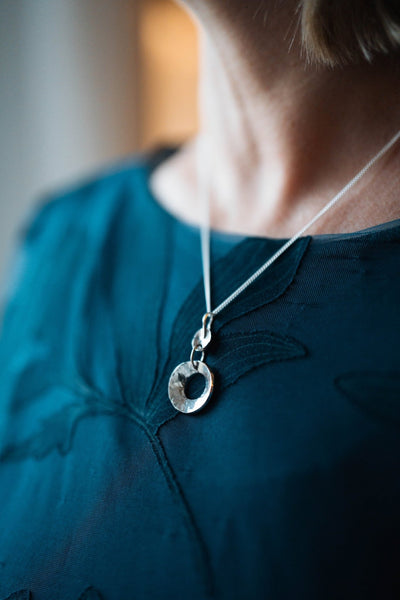 Sterling Silver Concave Pendant by LaVidaLoca Jewellery shown being worn