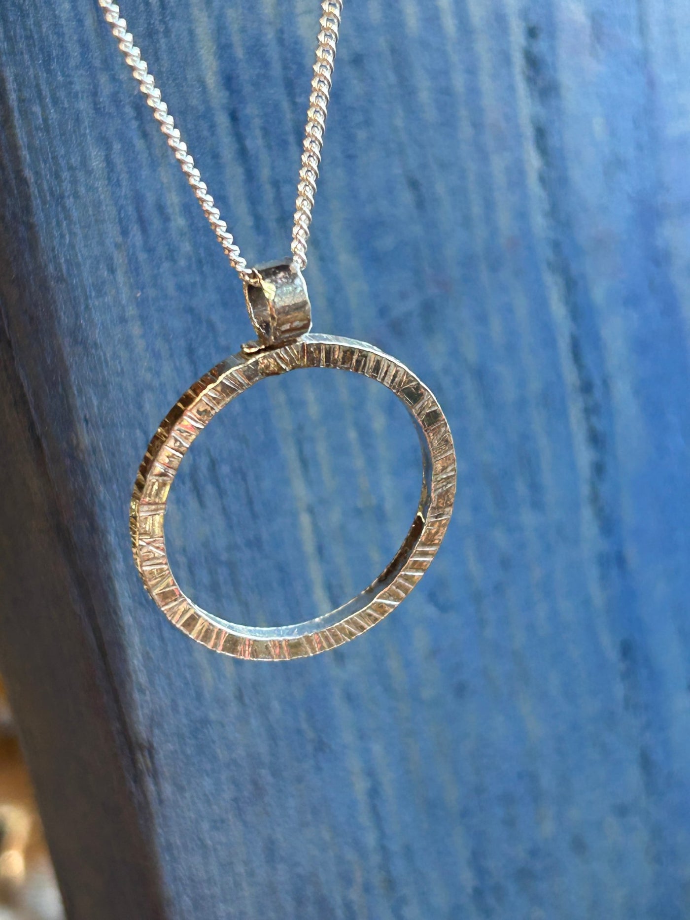 Sterling Silver Halo Pendant by LaVidaLoca Jewellery shown hanging