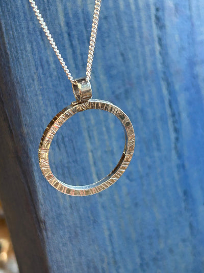 Sterling Silver Halo Pendant by LaVidaLoca Jewellery shown hanging