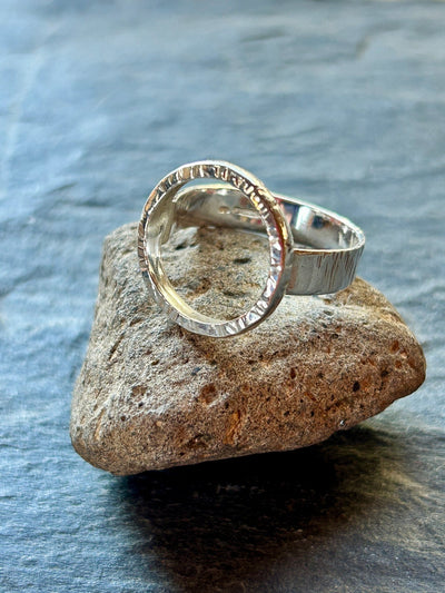 Sterling Silver Halo Ring by LaVidaLoca Jewellery shown on slate surface