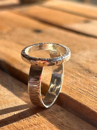 Sterling Silver Halo Ring by LaVidaLoca Jewellery shown on wooden surface in sun