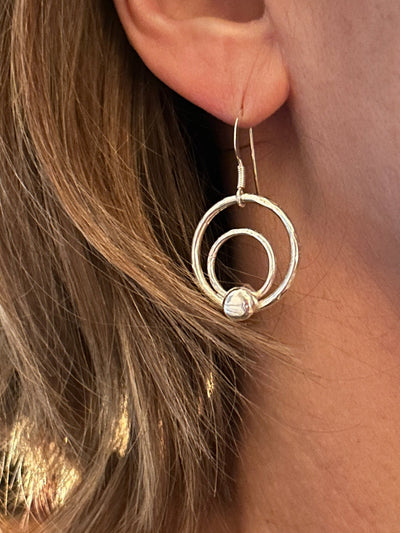 Sterling Silver Orbit Earrings by LaVidaLoca Jewellery shown being worn
