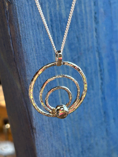 Sterling Silver Orbit Pendant by LaVidaLoca Jewellery shown hanging