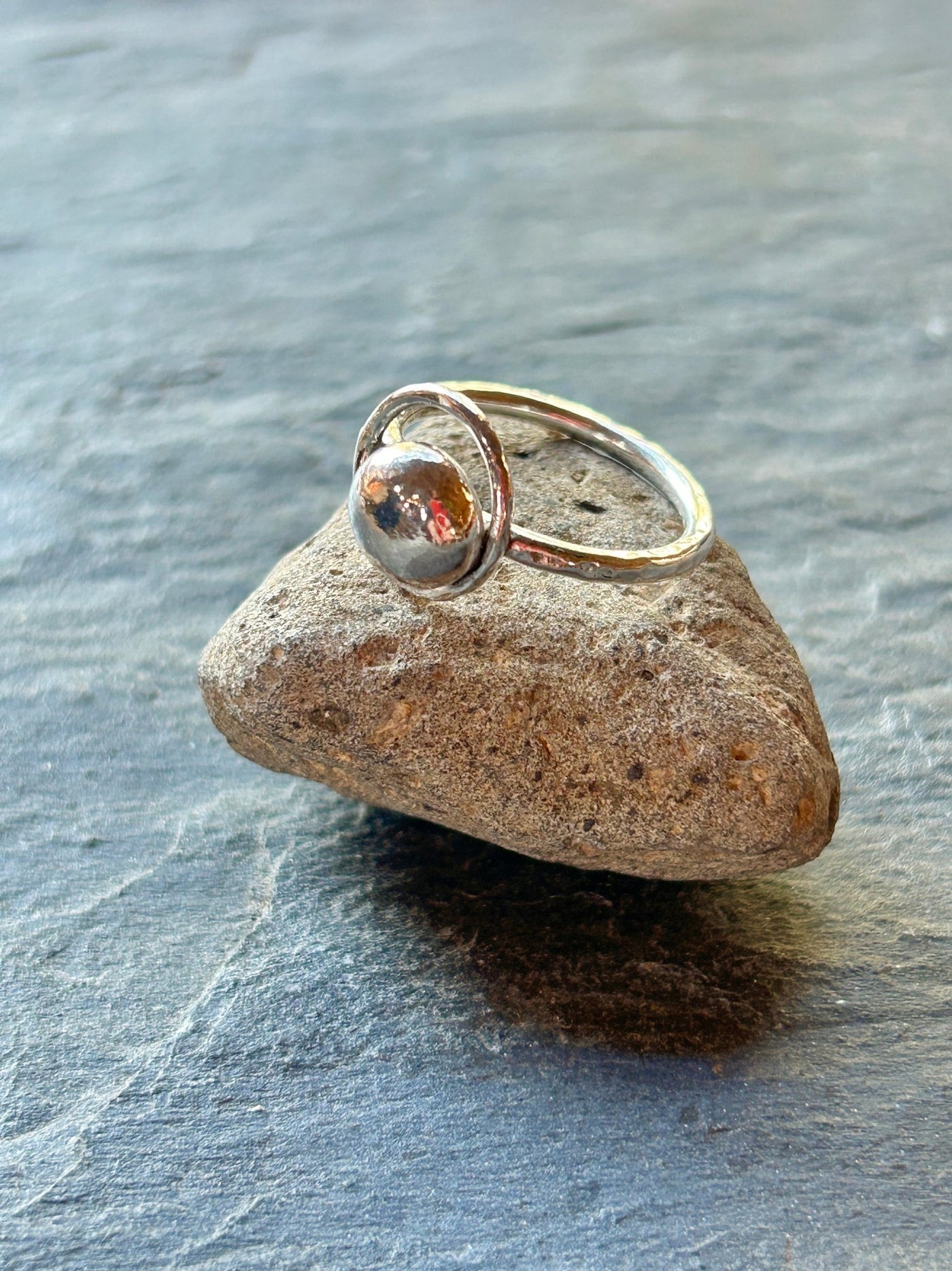 Sterling Silver Orbit Ring by LaVidaLoca Jewellery shown on a stone
