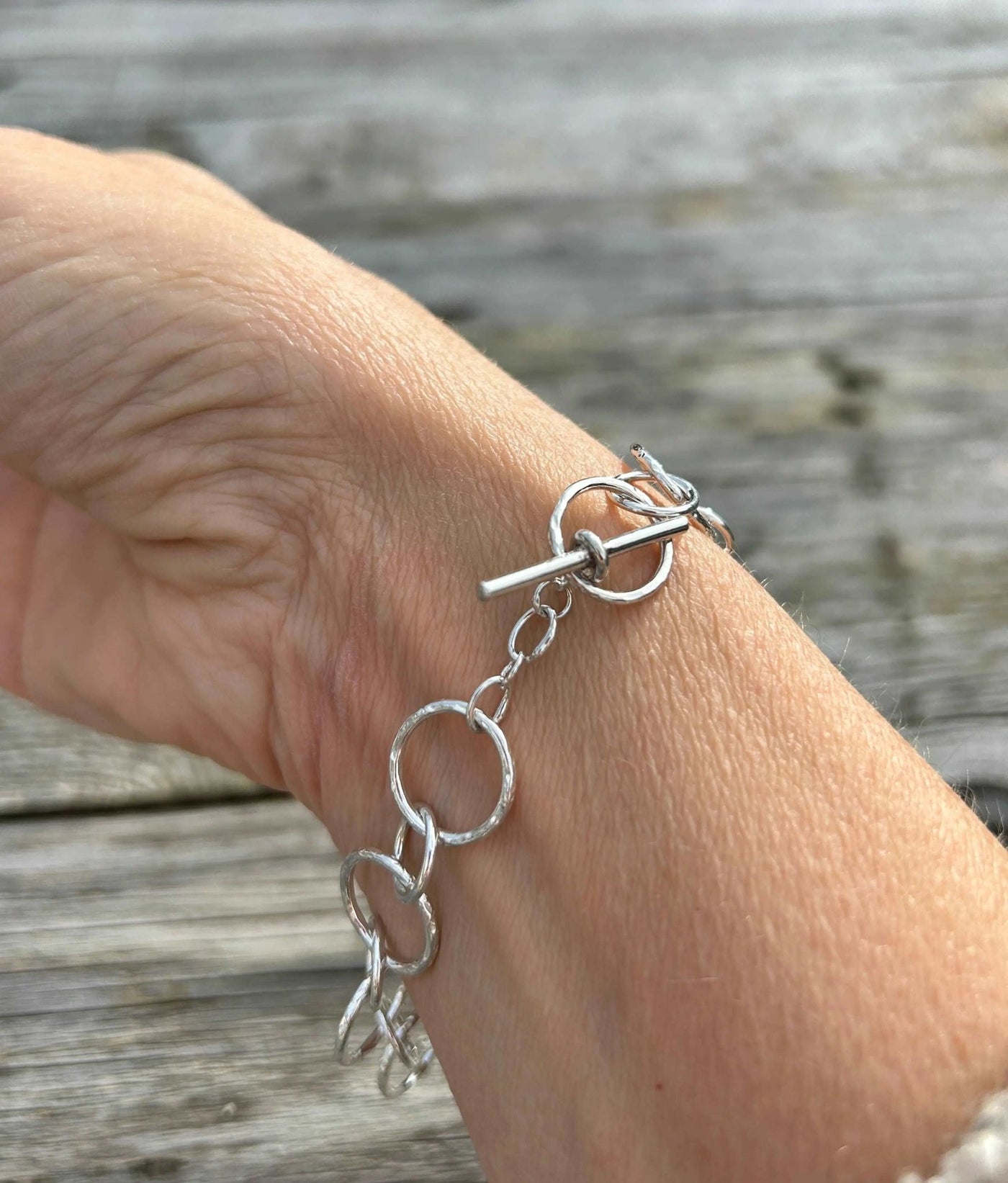 Sterling Silver handmade chain bracelet shown on arm showing clasp