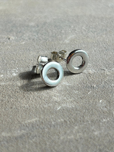 Sterling Silver Circle stud earrings by LaVidaLoca Jewellery shown on a slate