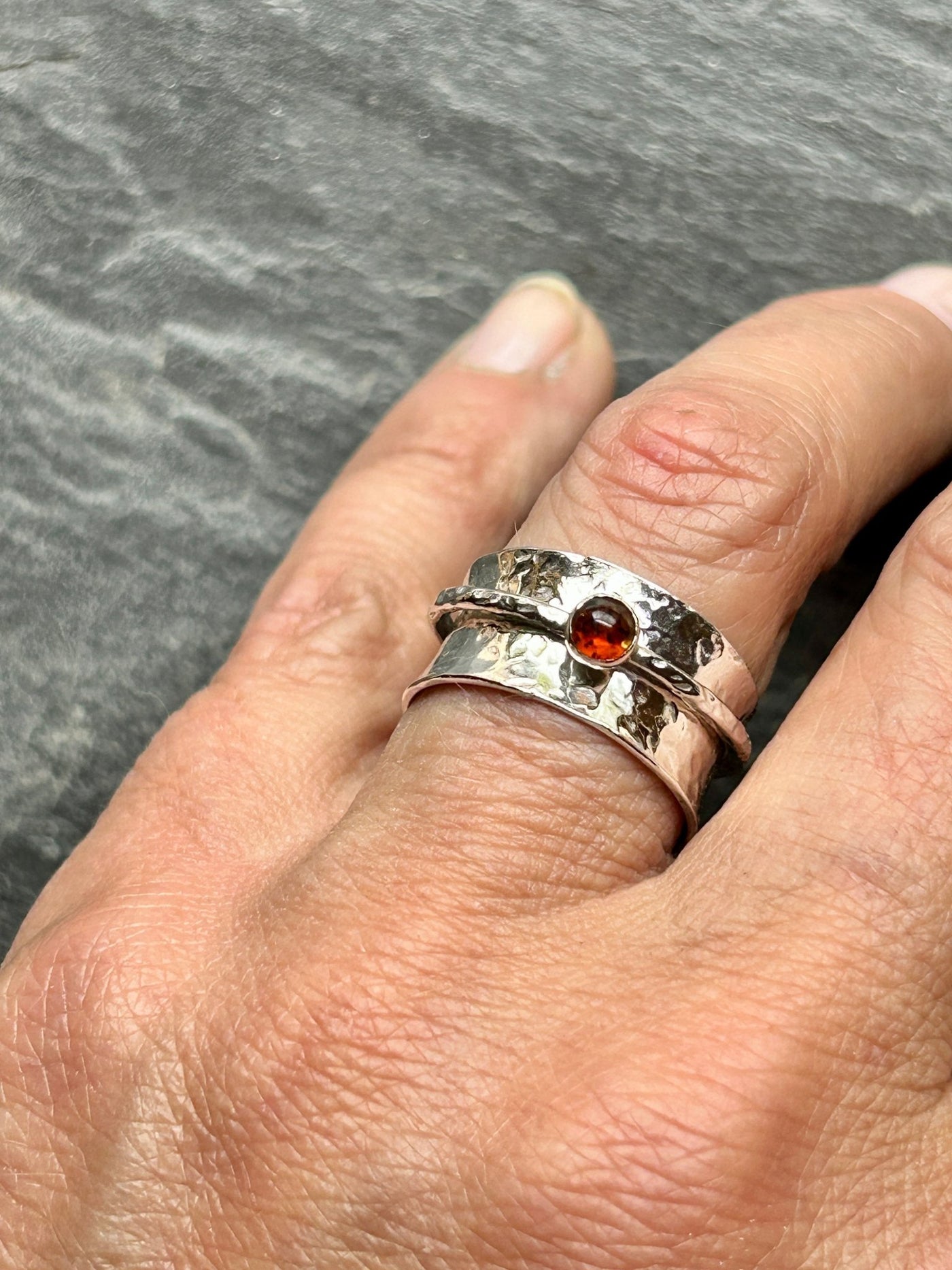 Sterling Silver Spinner ring with an Amber outer Spinning ring by LaVidaLoca Jewellery shown on a hand