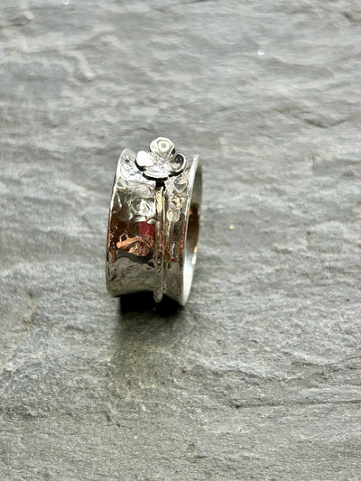 Sterling Silver Spinner ring - Four Leaf Clover Spinner shown on a grey slate by  LaVidaLoca Jewellery