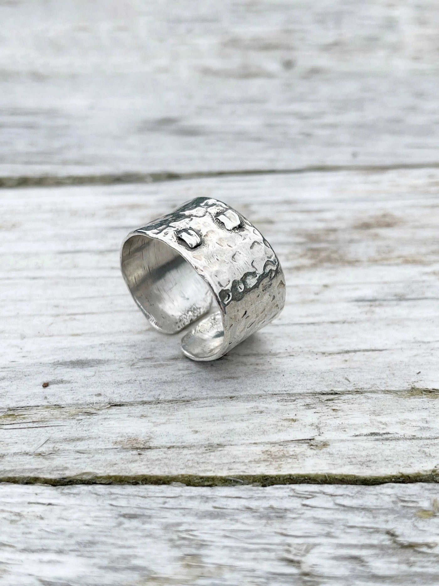 back detail of handmade Hammered Rivet Silver Ring with adjustable open-front design